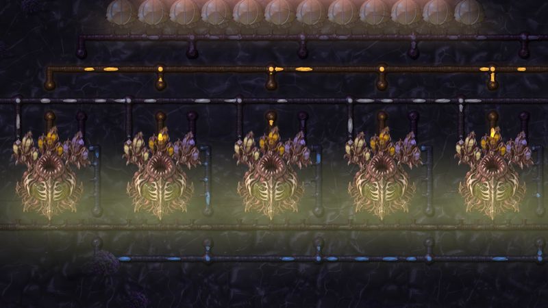 A row of ribbed organs with open mouths, lit green in the dark under pipes and bladders.